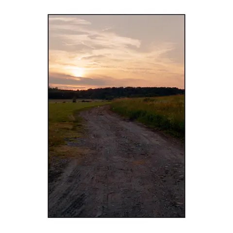 Sunset over a dirt road